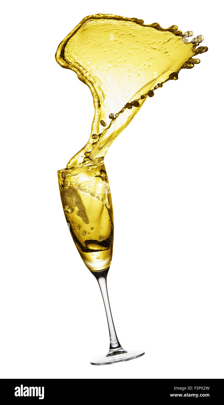Splashing champagne out of glass, isolated on white background. Stock Photo