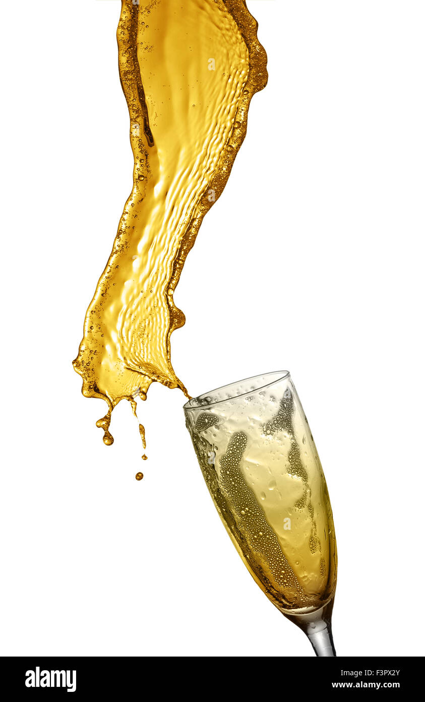 Splashing champagne out of glass, isolated on white background. Stock Photo