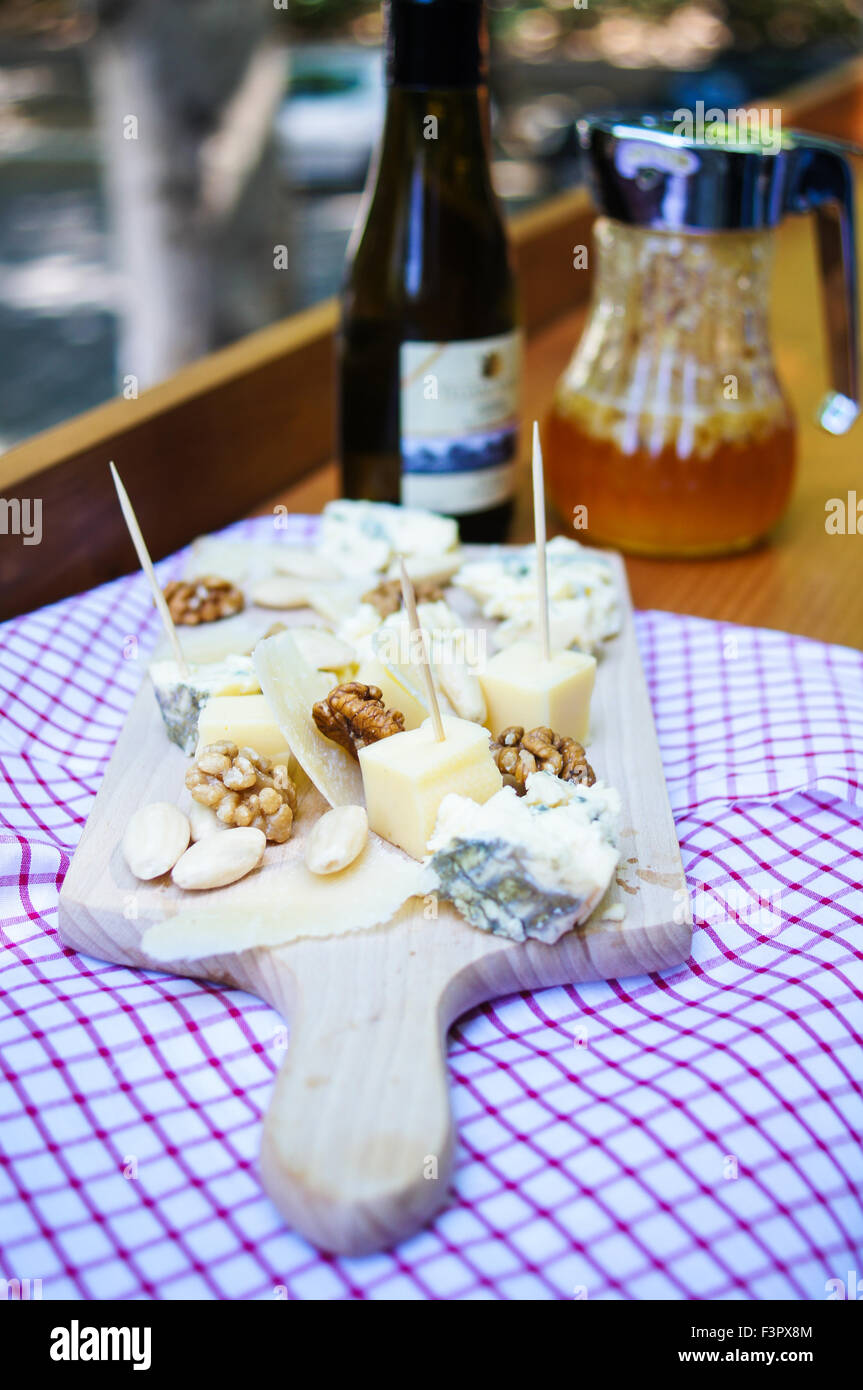 Still life with bottle of wine and cheese outdoor Stock Photo - Alamy