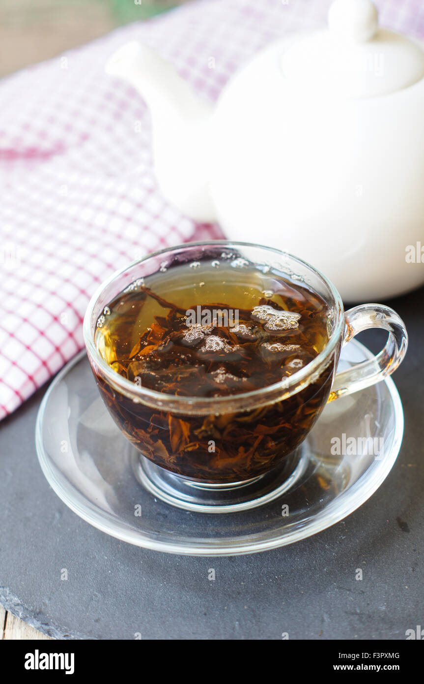 Black tea on wooden background, selective focus Stock Photo