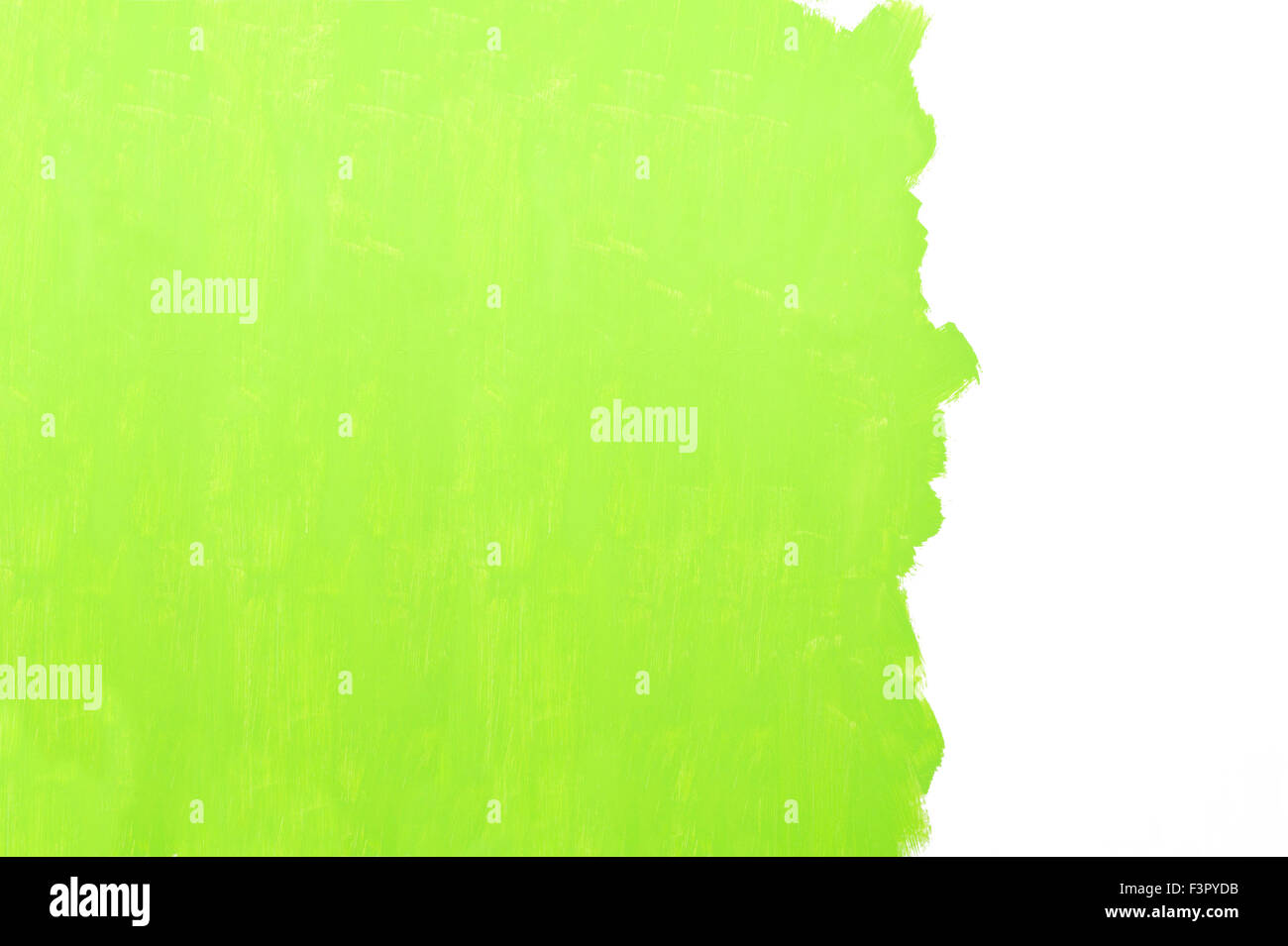 Painting a wall using a roller with green paint Stock Photo - Alamy