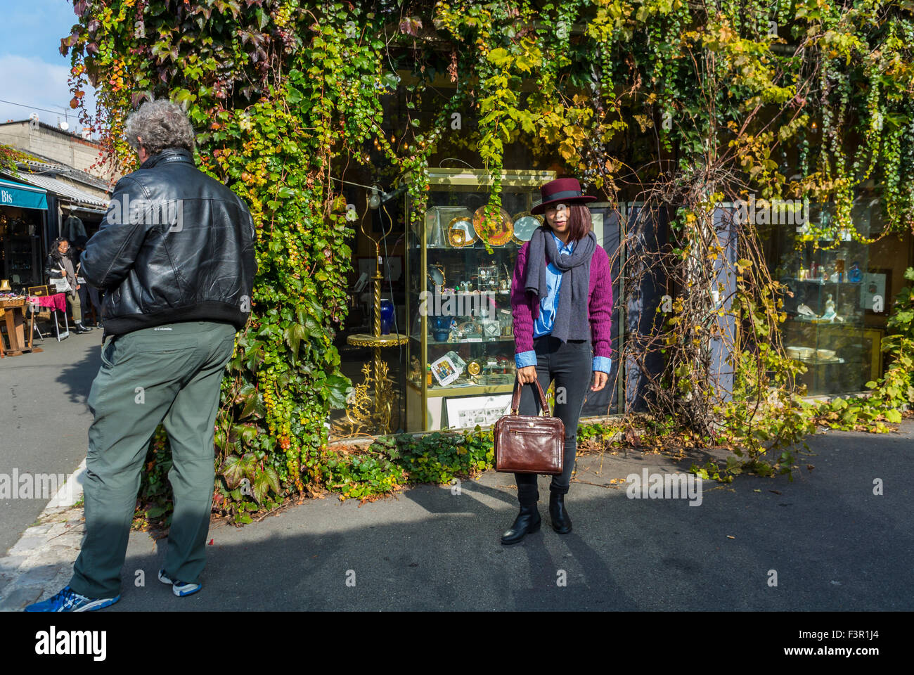 Paris, France, Chinese Tourists Shopping in French Flea Market, 'les Puces de Paris Saint Ouen', Porte de Clignancourt, Woman Posing on Street, Local neighbourhoods Stock Photo