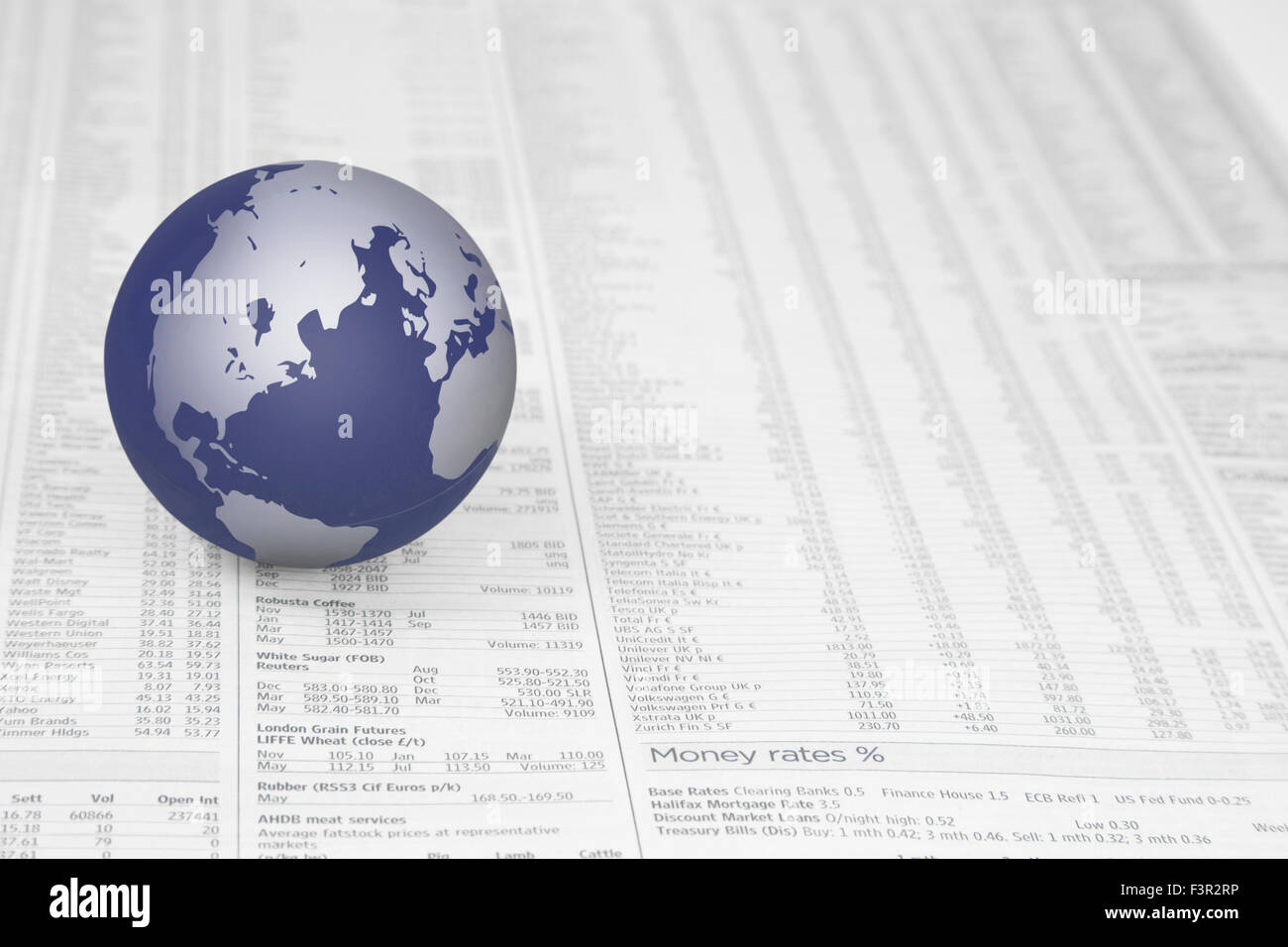 Map of the world globe on a News paper Stock market financial page