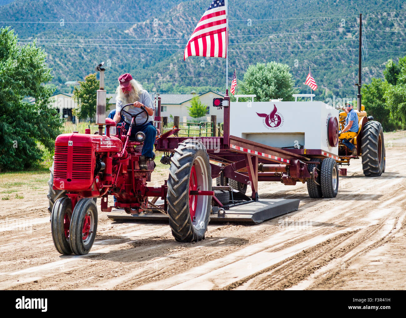 Rancher driving antique tractor, Antique Tractor Pull Event, Chaffee
