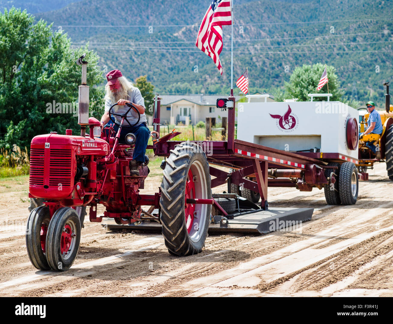Rancher driving antique tractor, Antique Tractor Pull Event, Chaffee County Fair & Rodeo, Salida, Colorado, USA Stock Photo