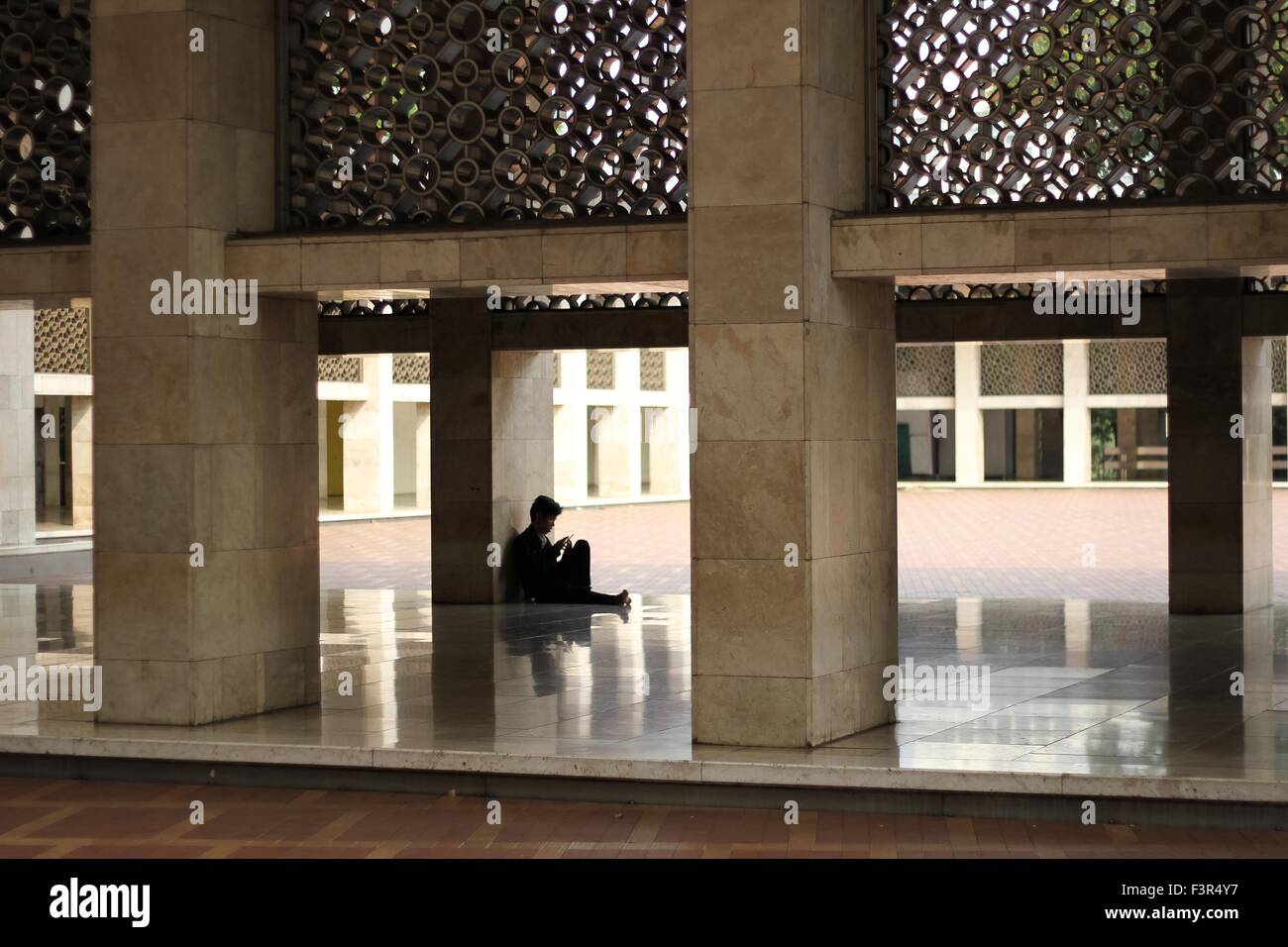 Jakarta, Indonesia. 09th Oct, 2015. Muslim rests at the Istiqlal Mosque. Istiqlal Mosque in Jakarta is the biggest mosque in Southeast Asia, befitting its location in the largest Muslim country in the world in terms of population. © Garry Andrew Lotulung/Pacific Press/Alamy Live News Stock Photo