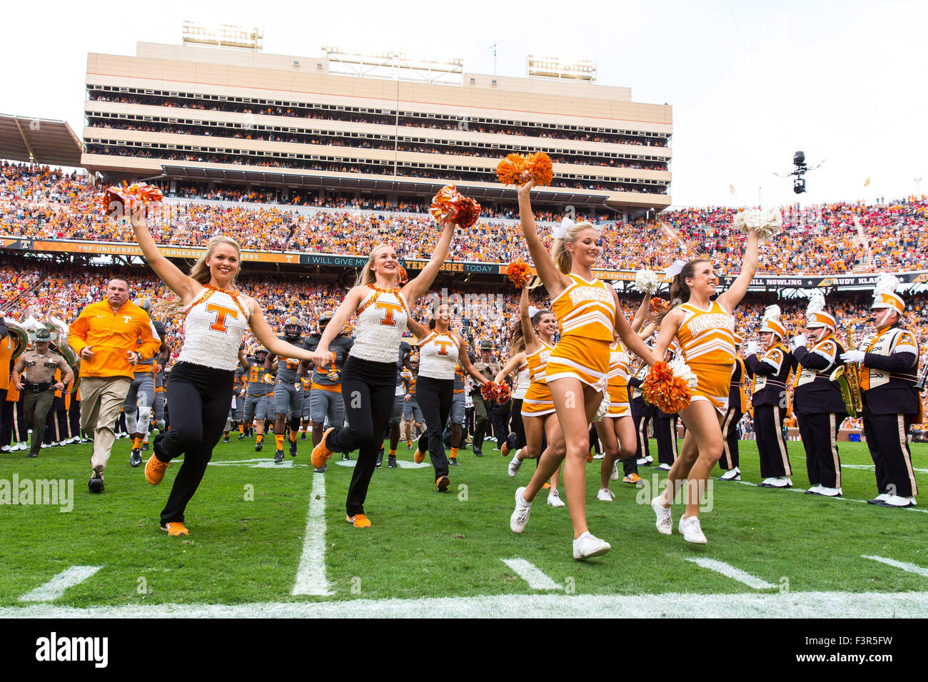 October 10, 2015: head coach Butch Jones of the Tennessee Volunteers and cheerleaders running through the power T before the NCAA Football game between the University of Tennessee Volunteers and the Georgia Bulldogs at Neyland Stadium in Knoxville, TN Tim Gangloff/CSM Stock Photo