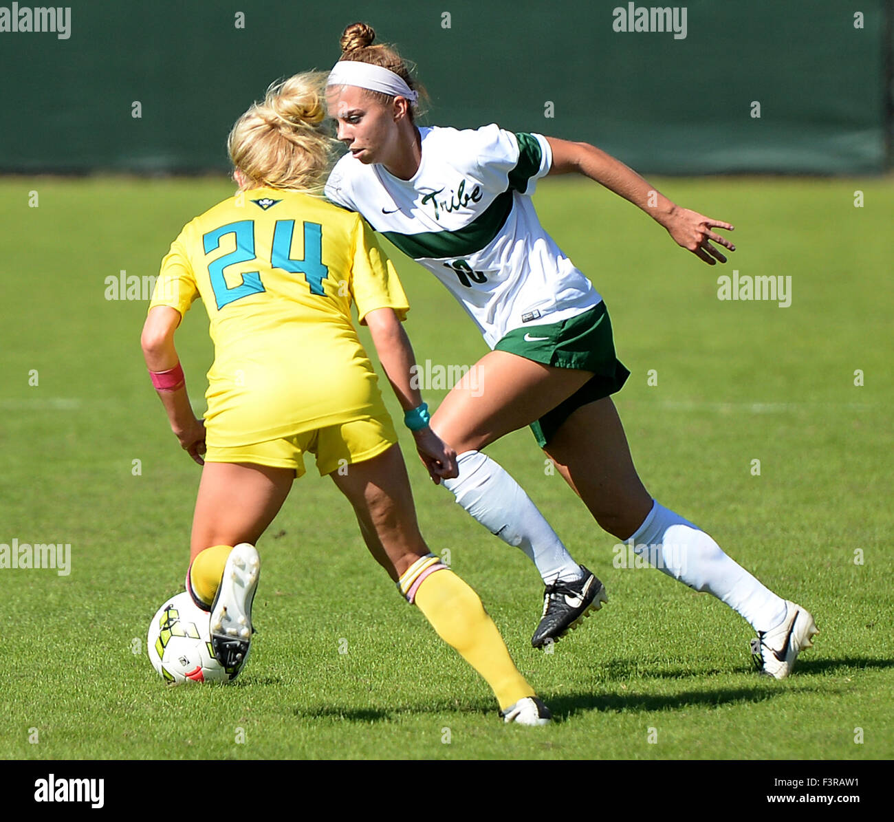Williamsburg, VA, USA. 11th Oct, 2015. 20151011 - William and Mary defender HALEY KENT (13) works the ball past UNC-Wilmington midfielder STEPHANIE BRONSON (24) in the first half at Martin Family Stadium in Williamsburg, Va. © Chuck Myers/ZUMA Wire/Alamy Live News Stock Photo