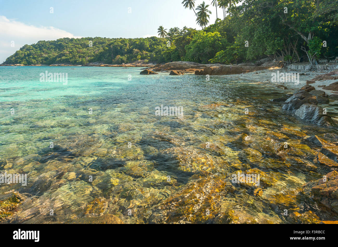 Beach rock with clear water Stock Photo - Alamy