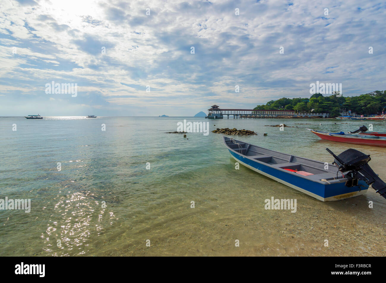 Boat with clear water and blue skies Stock Photo - Alamy