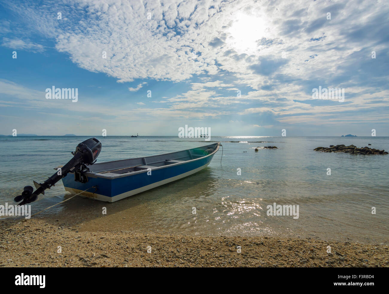 Boat with clear water and blue skies Stock Photo - Alamy