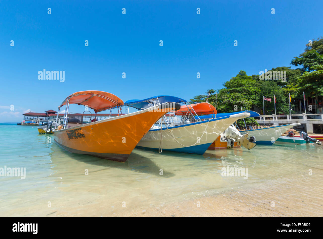 Boats with clear water and blue skies Stock Photo - Alamy
