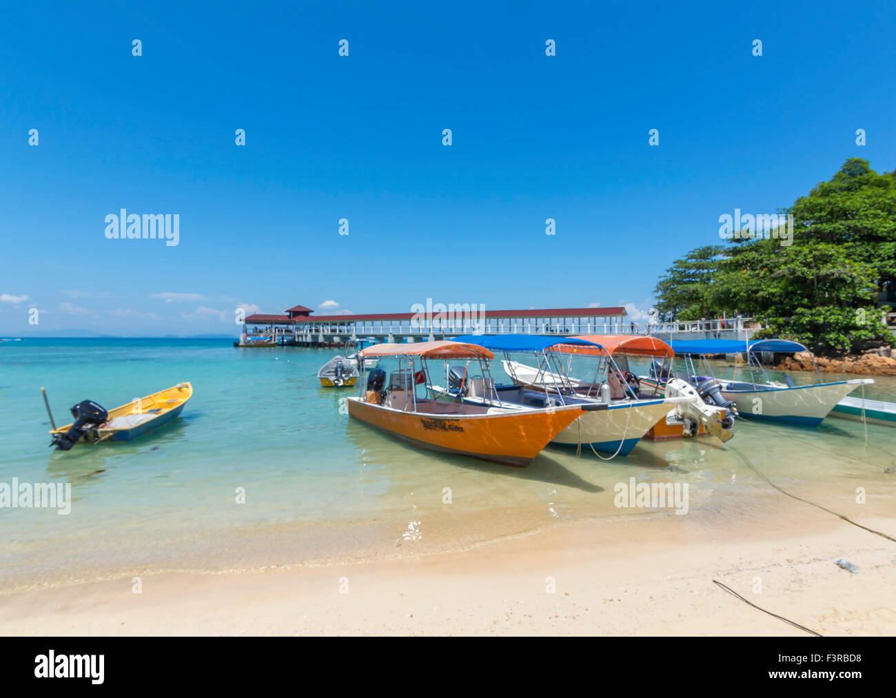 Boats with clear water and blue skies Stock Photo - Alamy