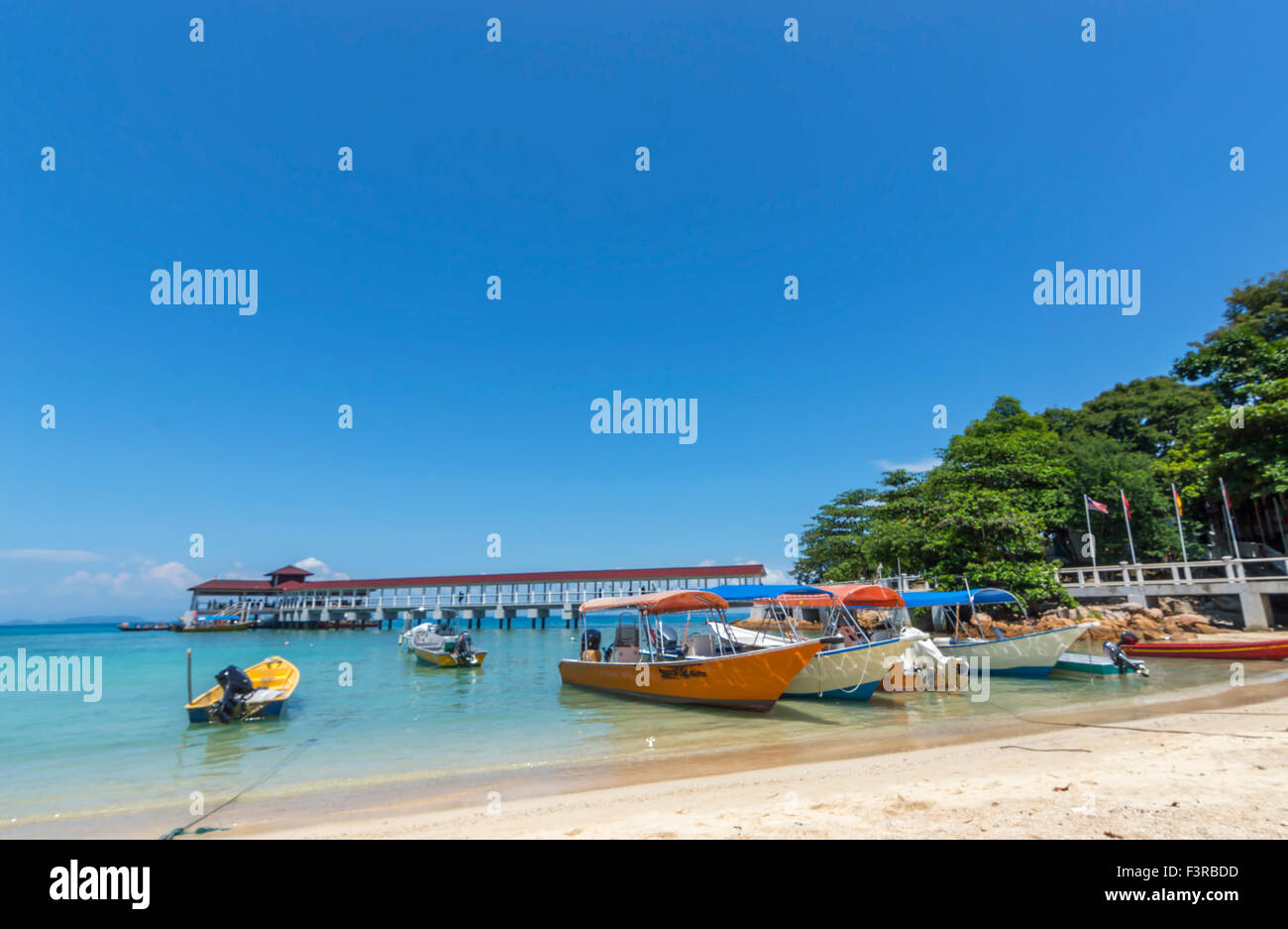 Boats with clear water and blue skies Stock Photo - Alamy