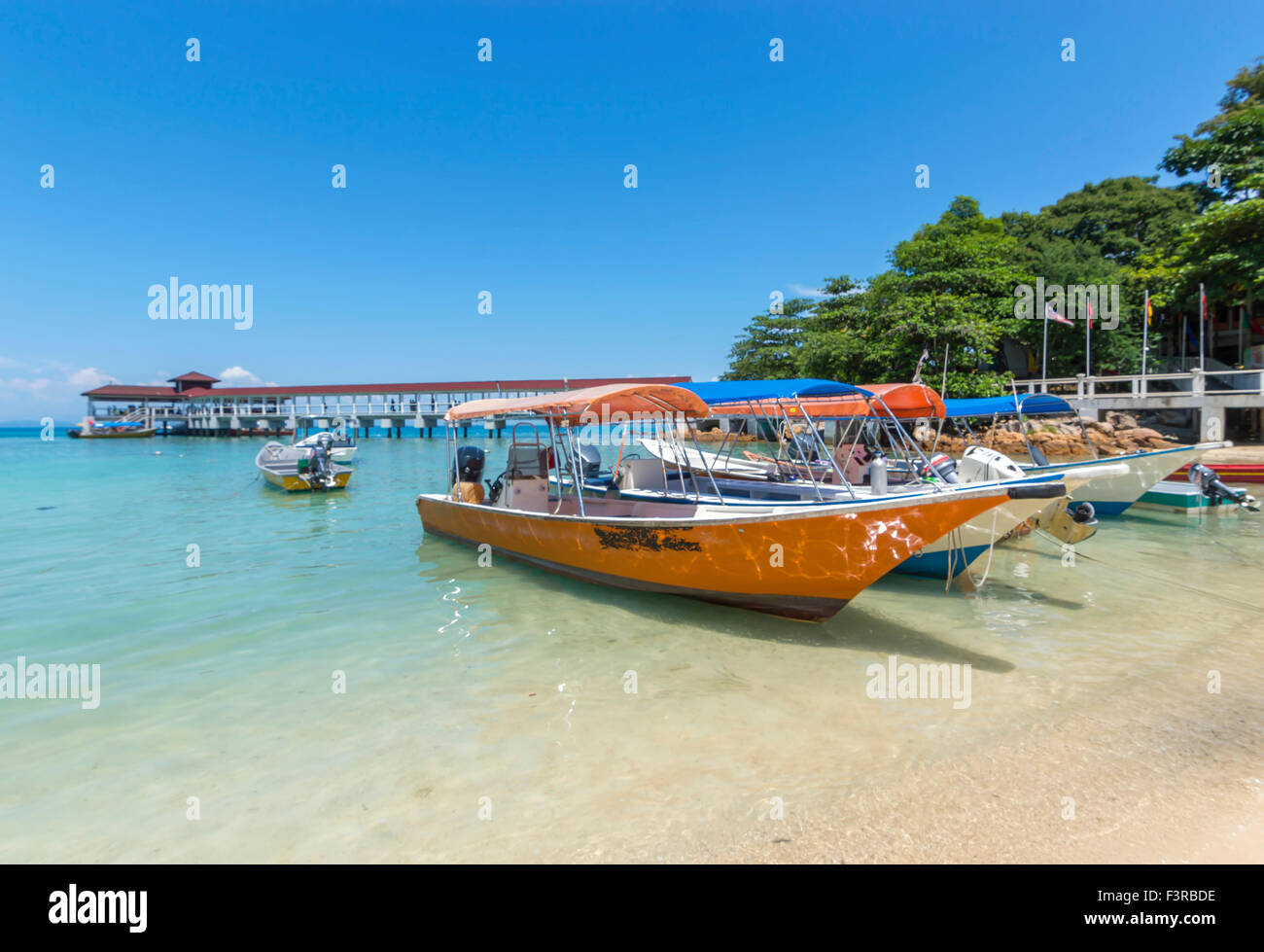 Boats with clear water and blue skies Stock Photo - Alamy