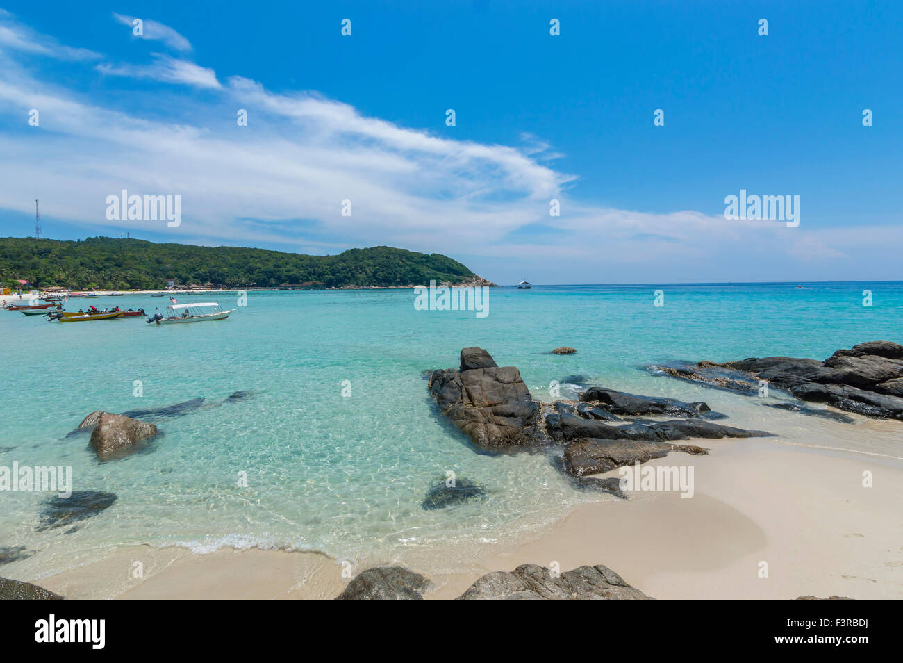 Beach with clear water and blue skies Stock Photo - Alamy