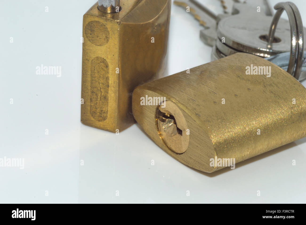 Padlock and key with white background Stock Photo - Alamy