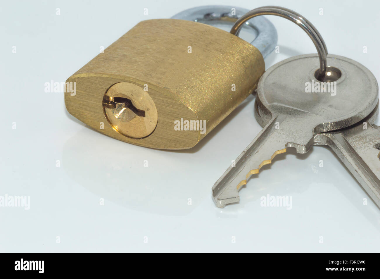 Padlock and key with white background Stock Photo - Alamy