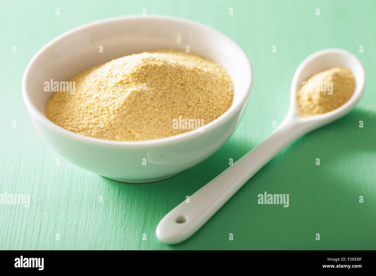 vegan nutritional yeast flakes in bowl Stock Photo