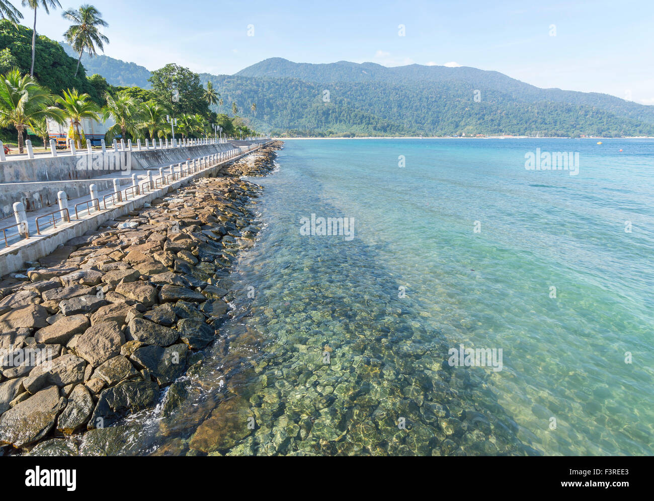 Beach rock with clear water Stock Photo - Alamy