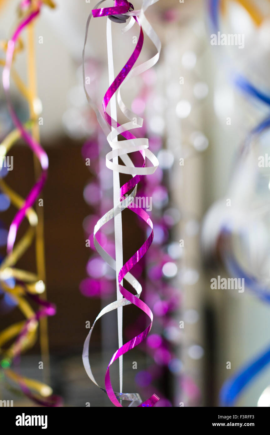 Shiny decorative ribbons hanging from helium balloons Stock Photo - Alamy