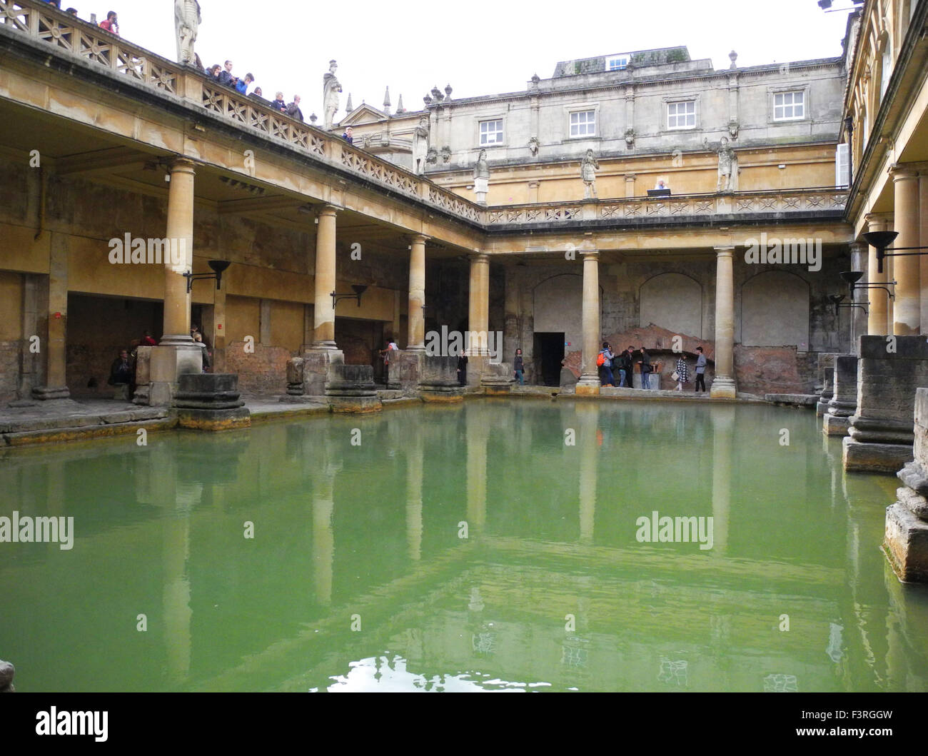 Visitors tourists to the Roman Baths ruins remains in the city of Bath in the UK. Stock Photo