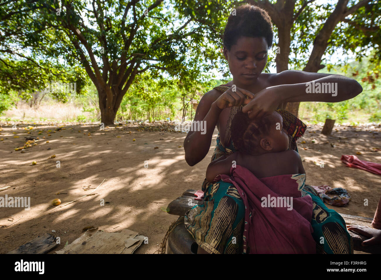 Traditional hairdresser in a village, Zambia, Africa Stock Photo