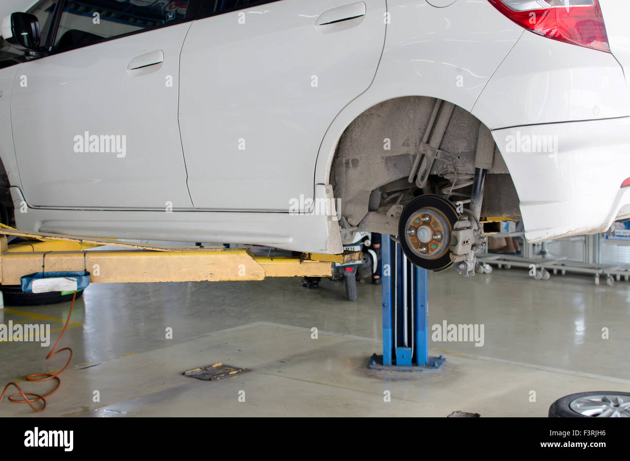 Inside a garage changing wheels/tires Stock Photo Alamy