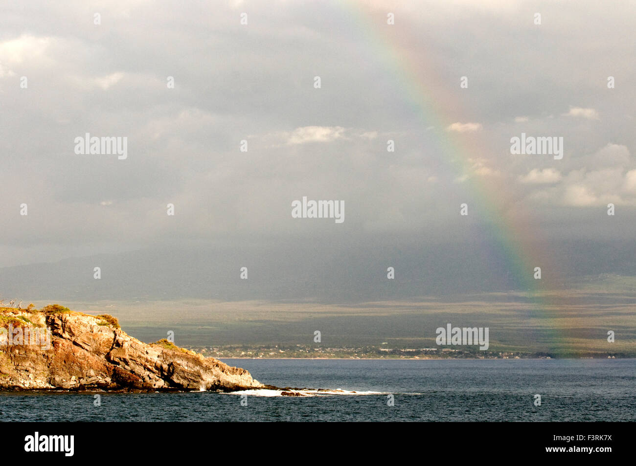 Rainbow in Papawai Point. Maui. Hawaii. The Pacific Whale Foundation is offering a free whale whalewatching information station Stock Photo