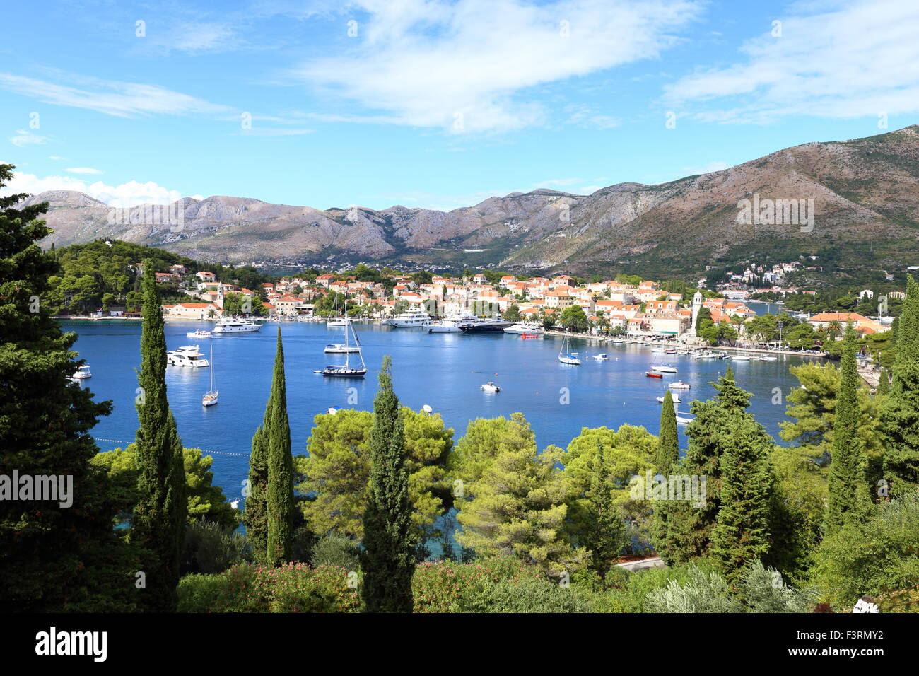 Cavtat harbour, seen from an elevated angle, edged with pine trees the harbour and small town look beautiful. Stock Photo
