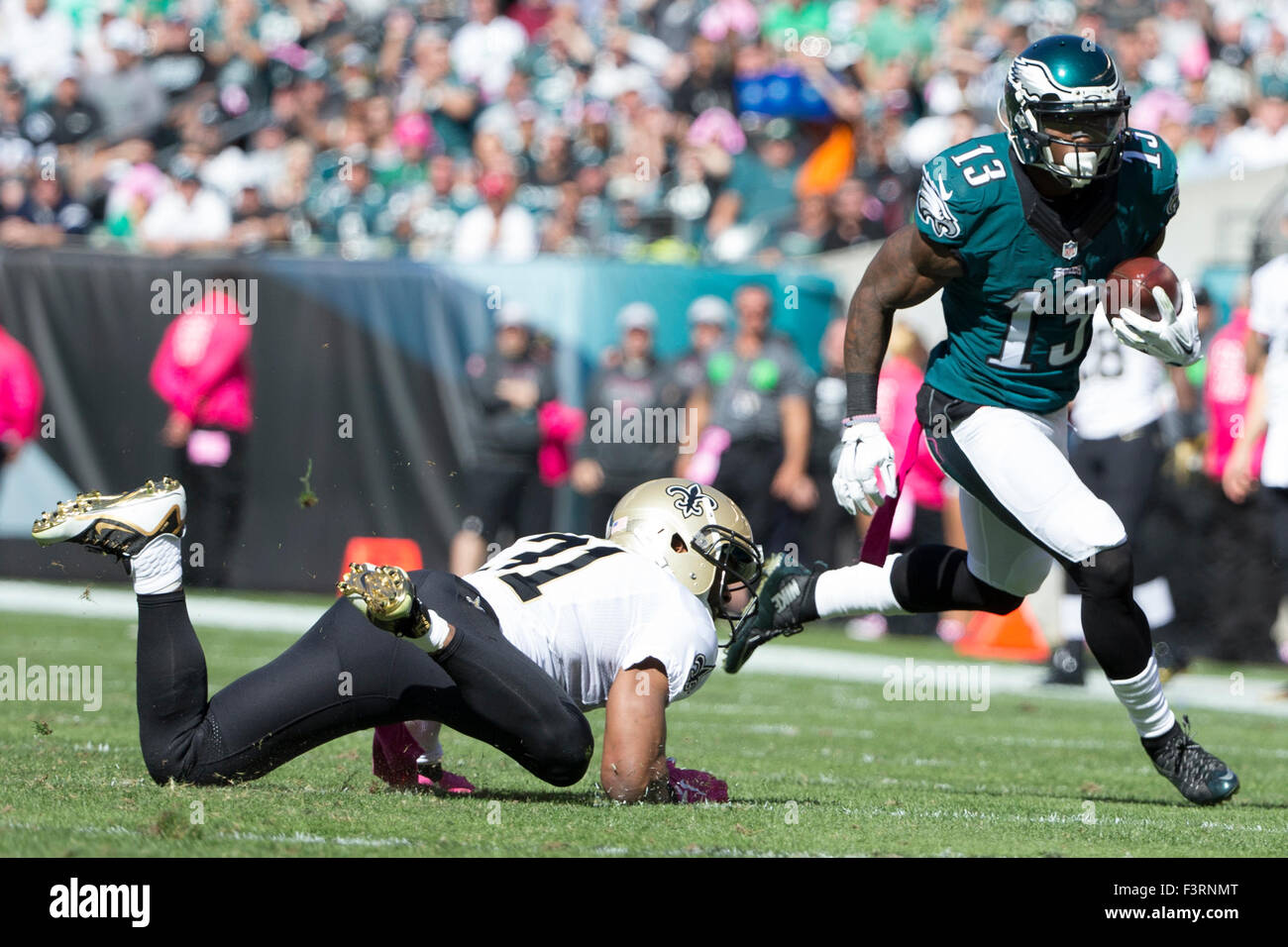Philadelphia, Pennsylvania, USA. 11th October, 2015. Philadelphia Eagles wide receiver Josh Huff (13) runs with the ball past New Orleans Saints free safety Jairus Byrd (31) during the NFL game between the New Orleans Saints and the Philadelphia Eagles at Lincoln Financial Field in Philadelphia, Pennsylvania. The Philadelphia Eagles won 39-17. Credit:  Cal Sport Media/Alamy Live News Stock Photo
