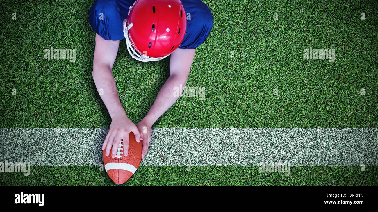 Composite image of american football player scoring a touchdown Stock Photo