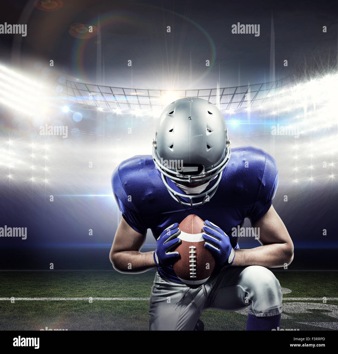 Composite image of american football player kneeling Stock Photo - Alamy