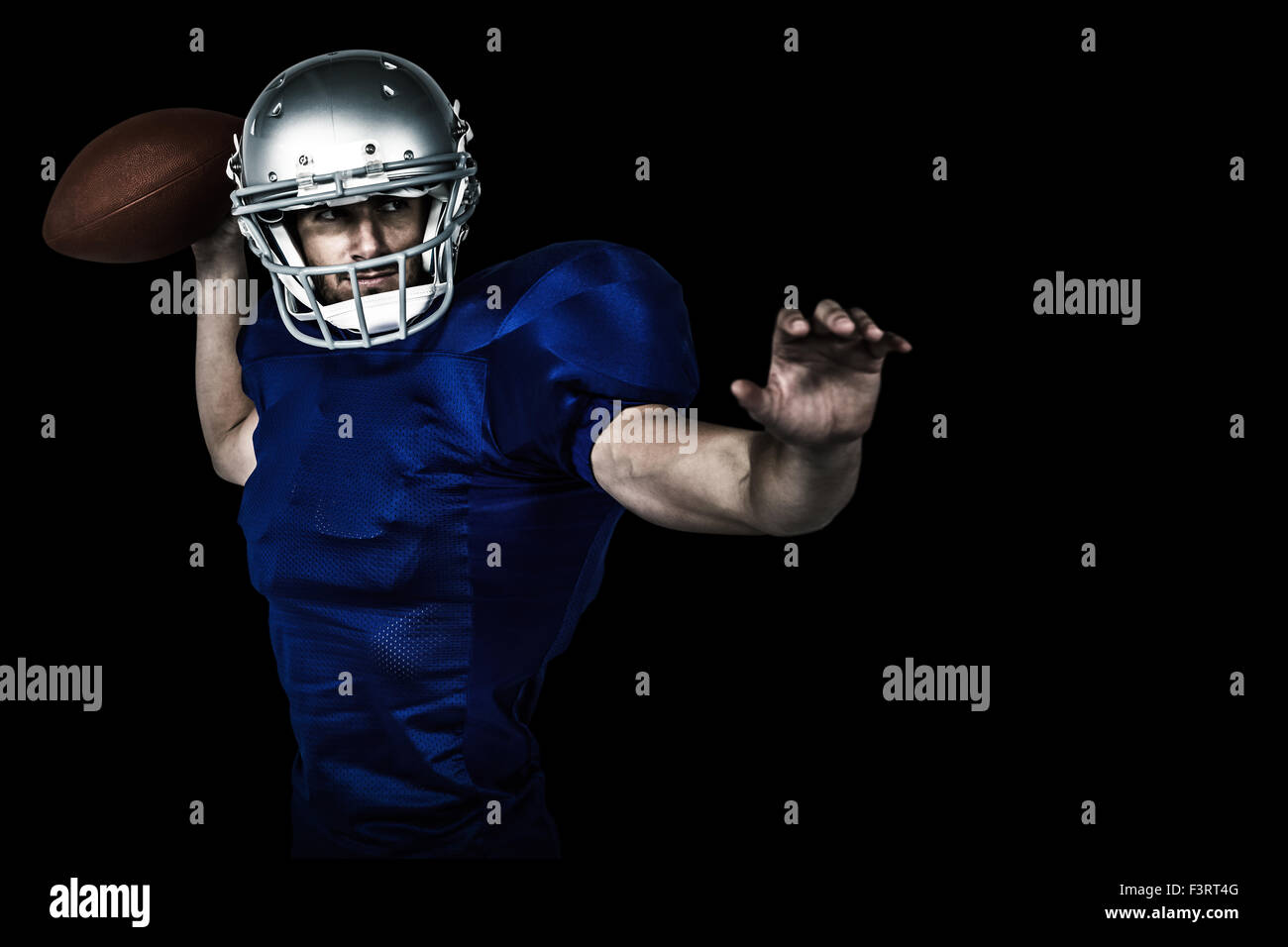 Composite image of american football player throwing ball Stock Photo
