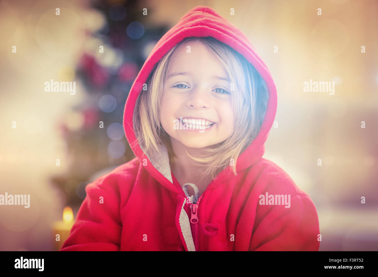 Festive little girl smiling at camera Stock Photo - Alamy