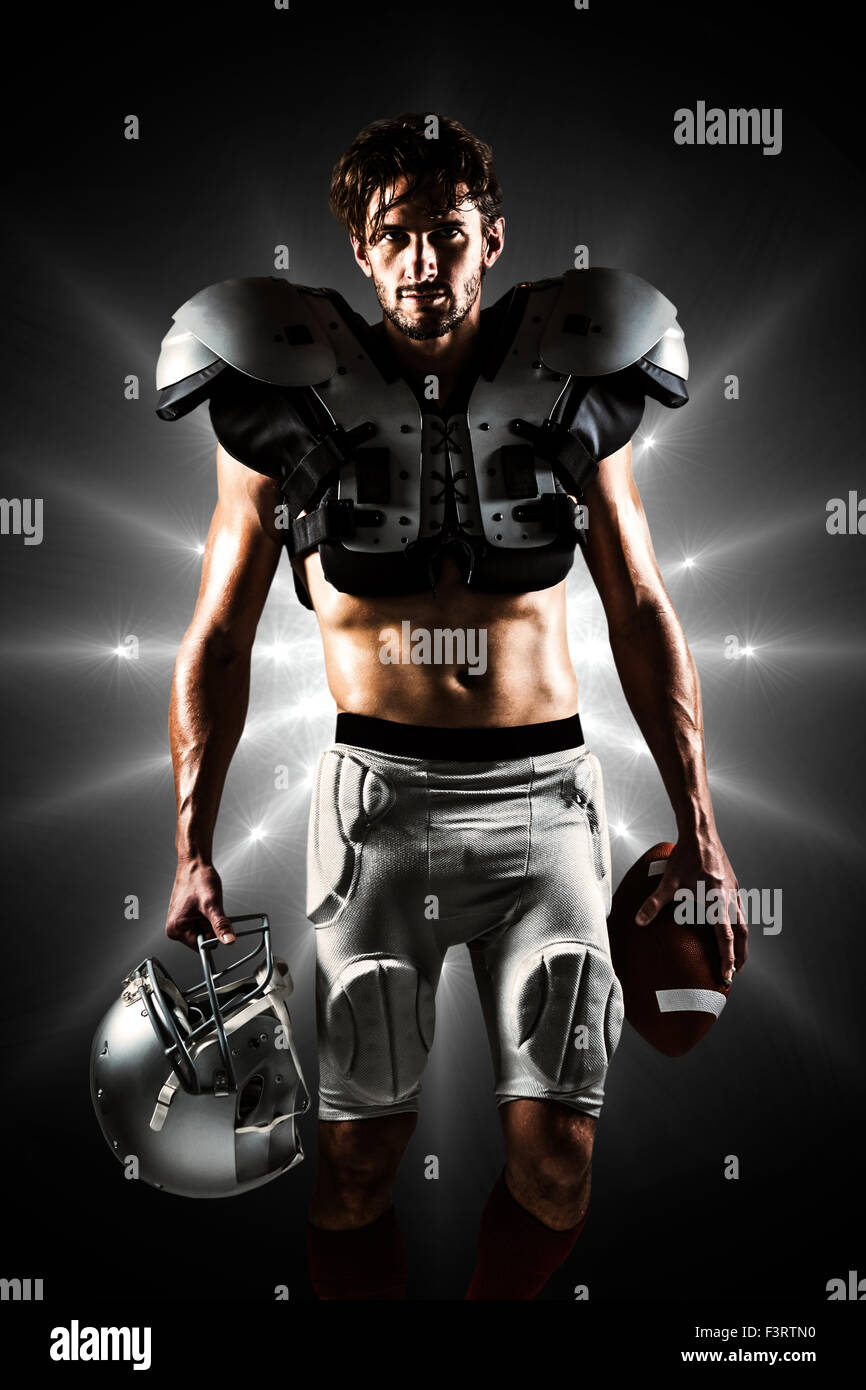 Composite image of shirtless american football player with padding