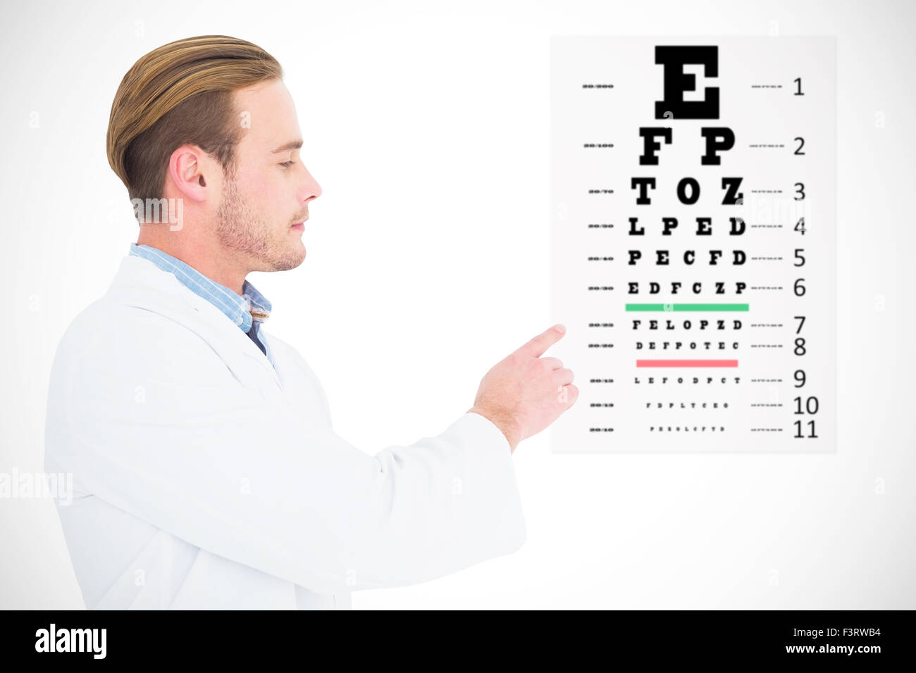 Composite image of optician in coat pointing eye test Stock Photo