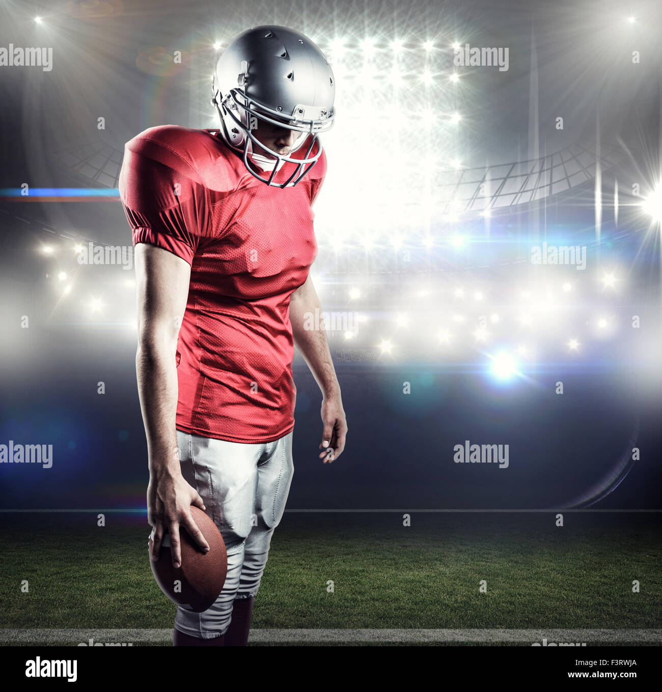 Composite image of portrait of rugby player wearing shoulder pads and  holding helmet Stock Photo - Alamy