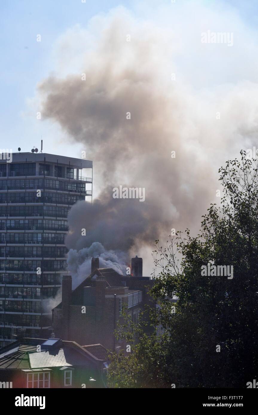 A major fire started about 13:00hr in University of Bristol Student accommodation, 33 Colston Street, Bristol, England, 12 October 2015, tackled by Avon Fire & Rescue services with two turntable ladder fire engines and more than four other engines. The location is between the Colston Hall and Griffin pub near the junction of Colston Street and Trenchard Street and these roads have been closed to both vehicles and pedestrians. The blaze has completely destroyed the whole length of roof and top floor.  Credit:  Charles Stirling/Alamy Live News Stock Photo