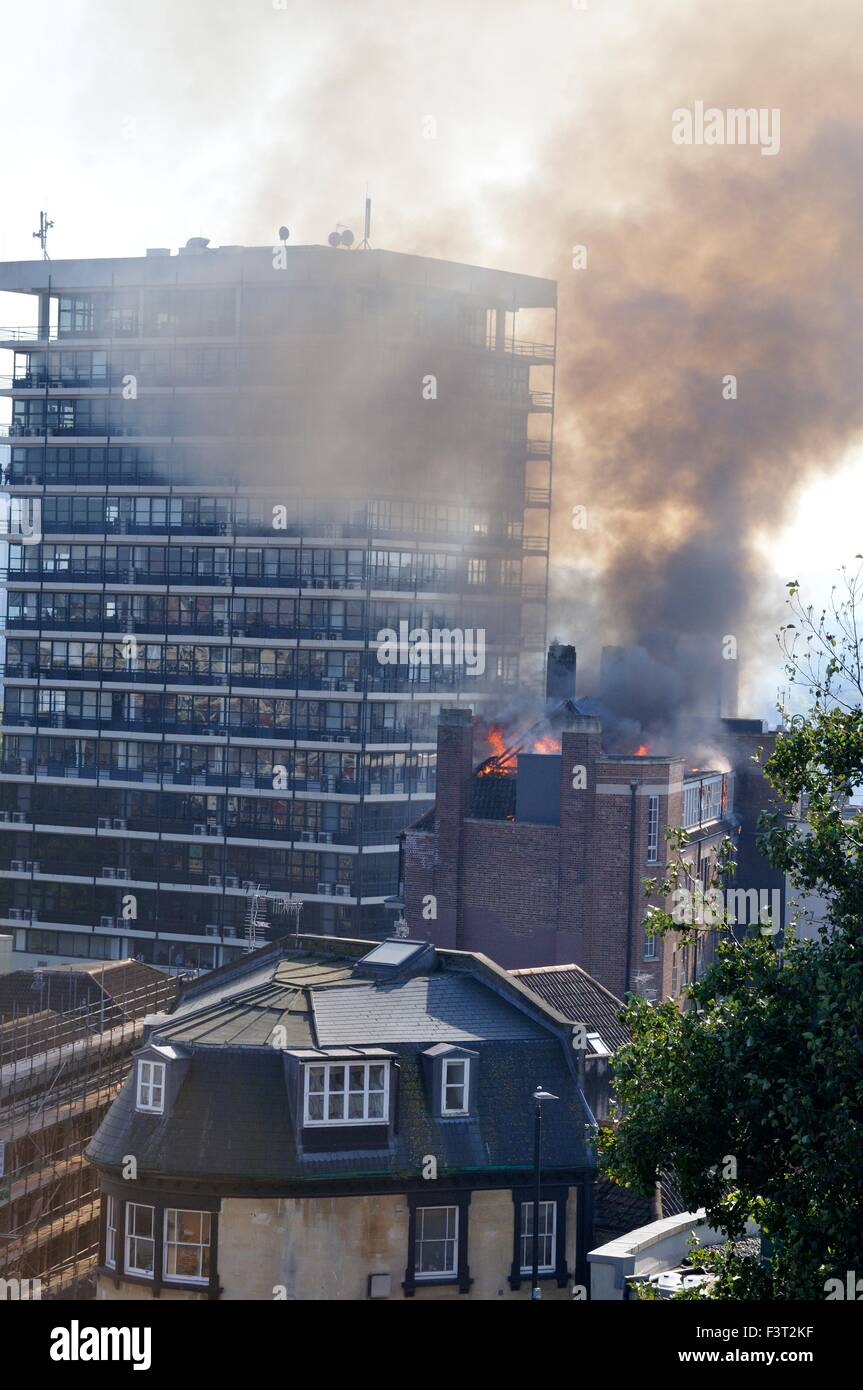 A major fire started about 13:00hr in University of Bristol Student accommodation, 33 Colston Street, Bristol, England, 12 October 2015, tackled by Avon Fire & Rescue services with two turntable ladder fire engines and more than four other engines. The location is between the Colston Hall and Griffin pub near the junction of Colston Street and Trenchard Street and these roads have been closed to both vehicles and pedestrians. The blaze has completely destroyed the whole length of roof and top floor. . Credit:  Charles Stirling/Alamy Live News Stock Photo