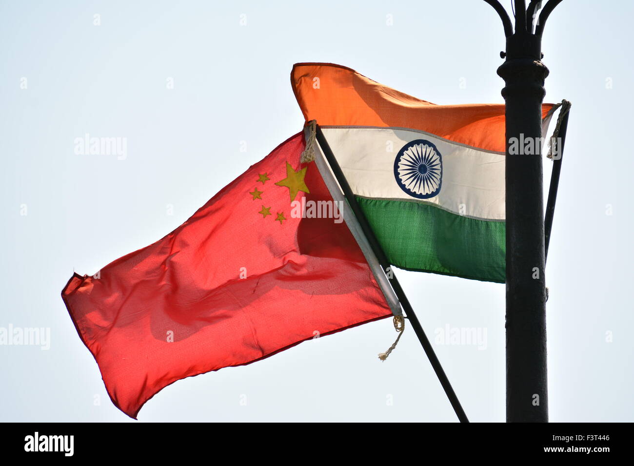 Chinese and Indian Flag on poll Stock Photo
