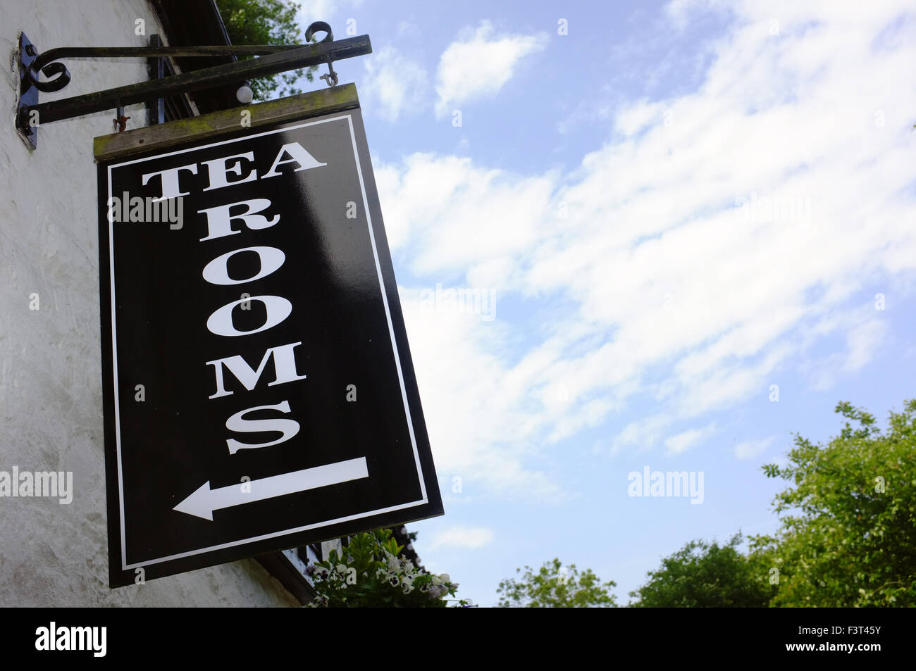 A sign directing pedestrian to a Tea Rooms in the village of Cheddar in Somerset. Stock Photo