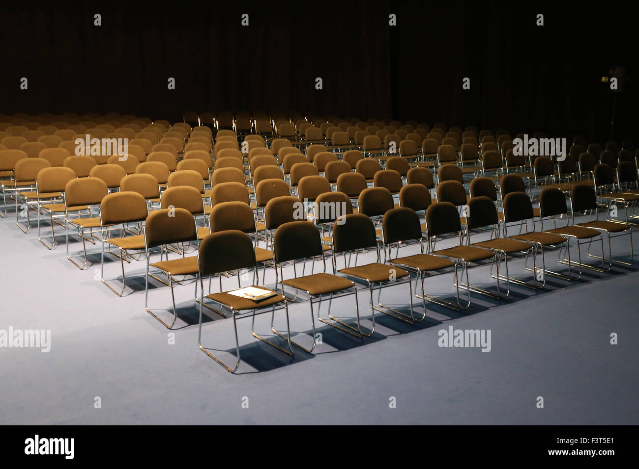 Rows of empty chairs prepared for an indoor event Stock Photo