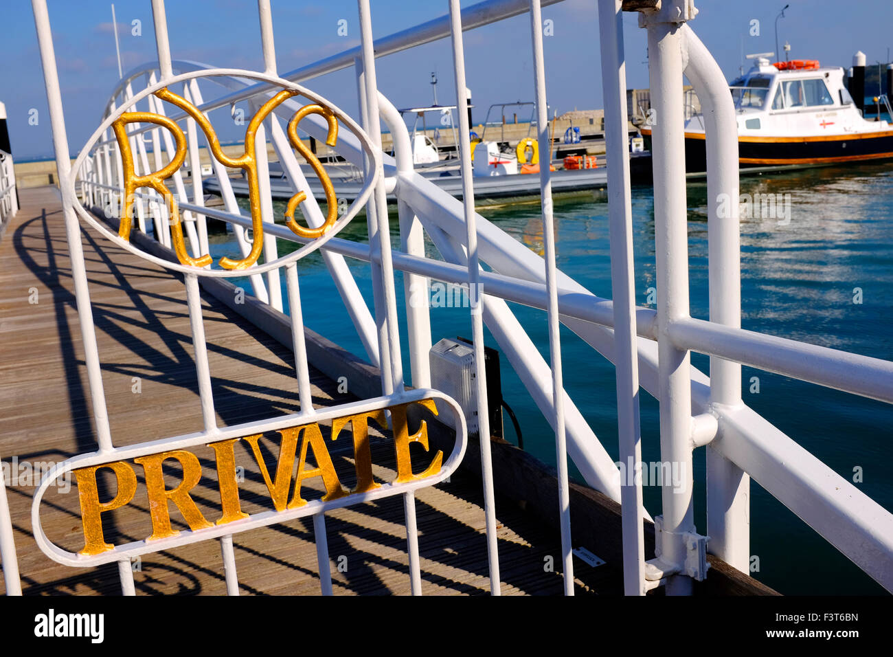 Marina gate entrance private The Royal Yacht Squadron is one of the most prestigious yacht clubs in the world. Its clubhouse is Cowes Castle on the Isle of Wight in the United Kingdom. Member yachts are given the Suffix RYS to their names, and permitted to fly the White Ensign of the Royal Navy[1] rather than the merchant Red Ensign flown by the majority of other UK registered vessels. The club's patron is Queen Elizabeth II and the club's admiral is Prince Philip who is also a former club Stock Photo