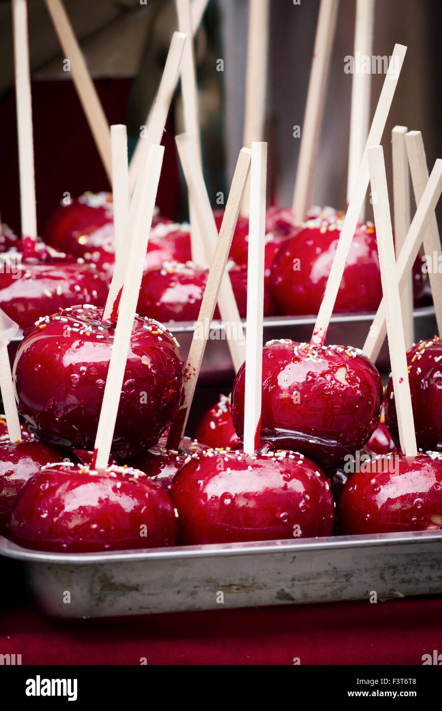 Delicious red candy apples on sticks Stock Photo Alamy