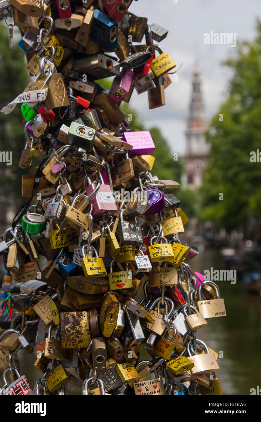 Love locks on one of the canal bridges near the Zuiderkerk (southern church), Amsterdam, Netherlands. Stock Photo