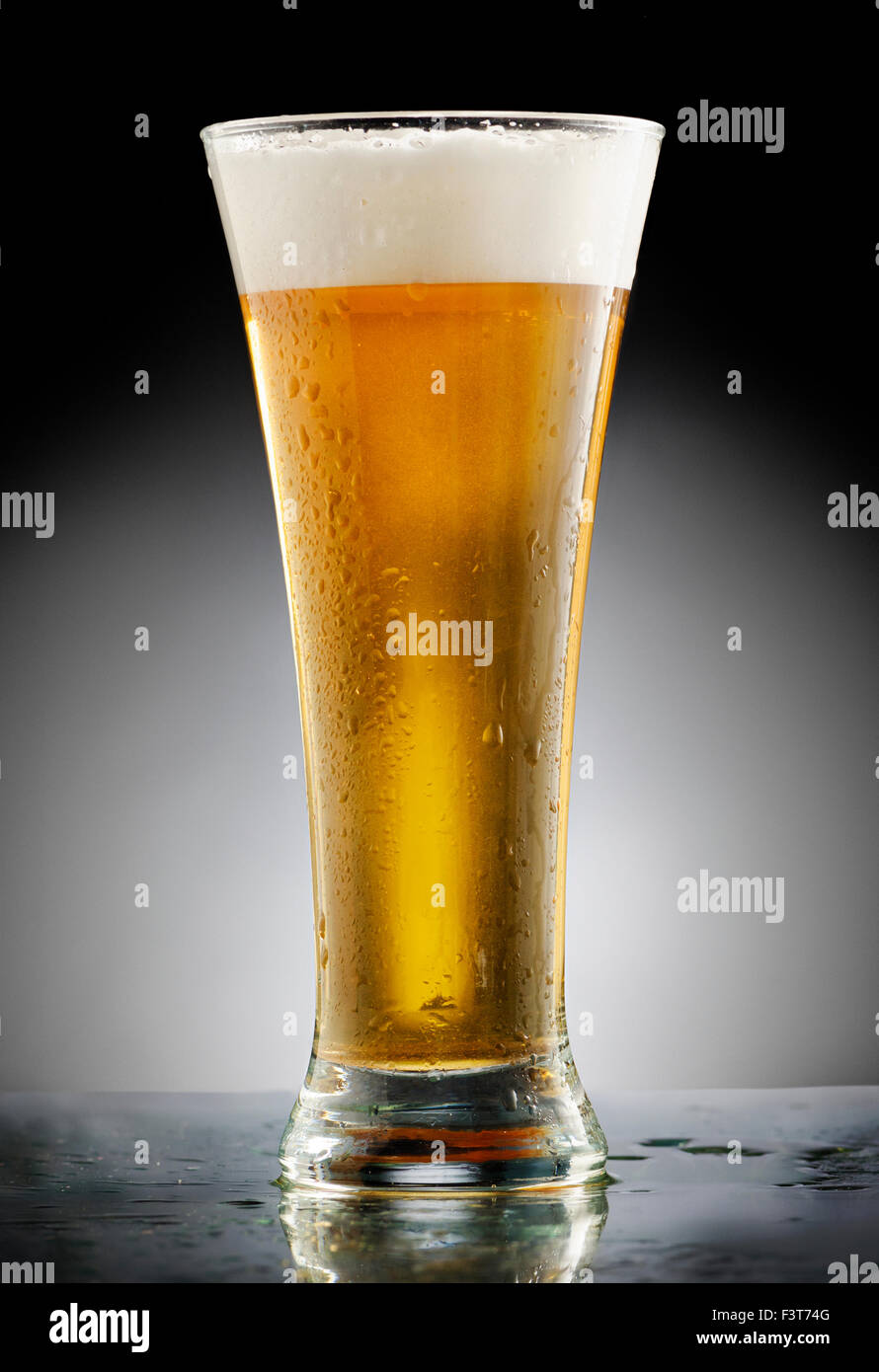 Glass of beer on black background Stock Photo