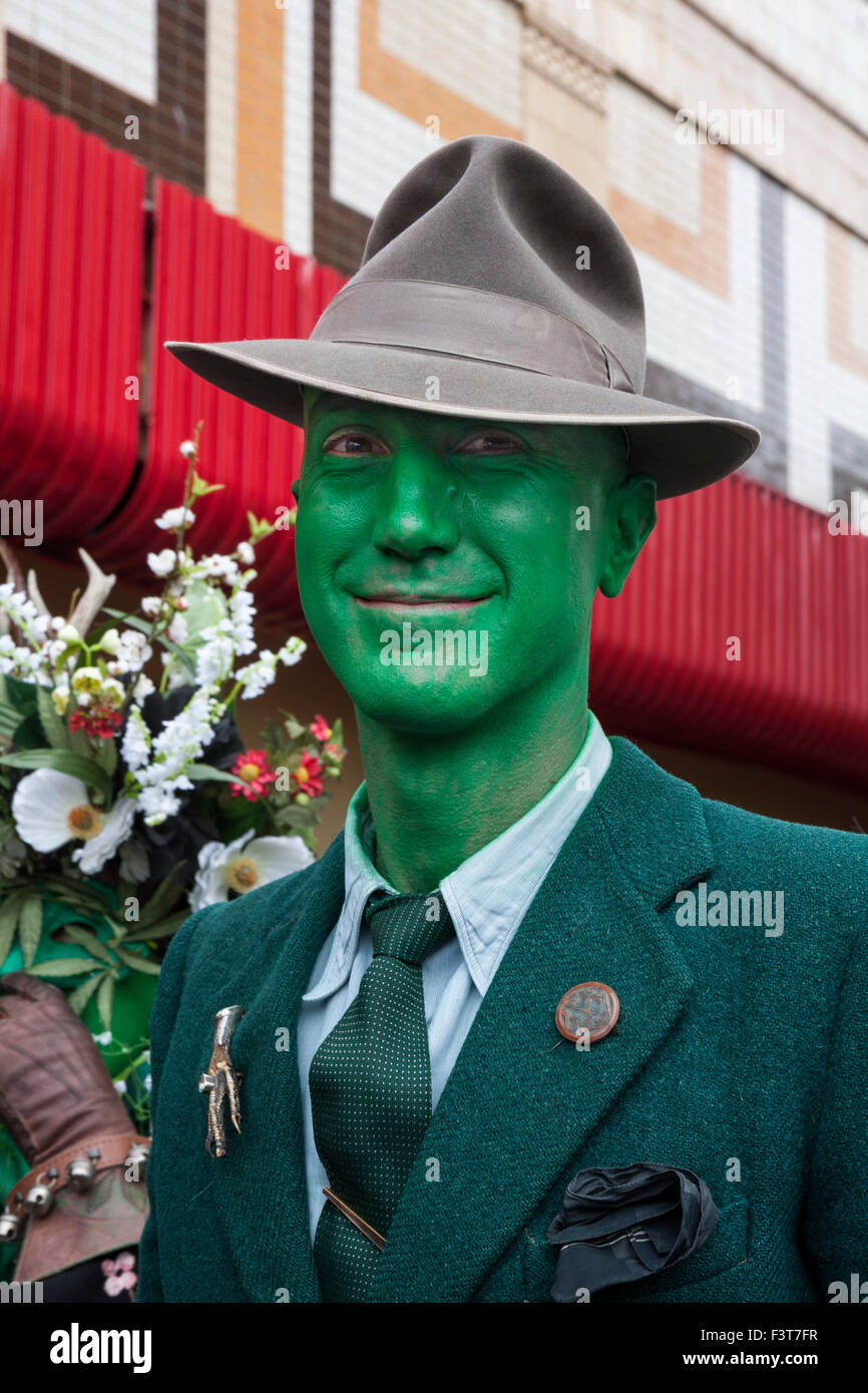 Man with green face in a trilby at the traditonal Jack in the Green festival, Hastings, East Sussex, England, UK Stock Photo