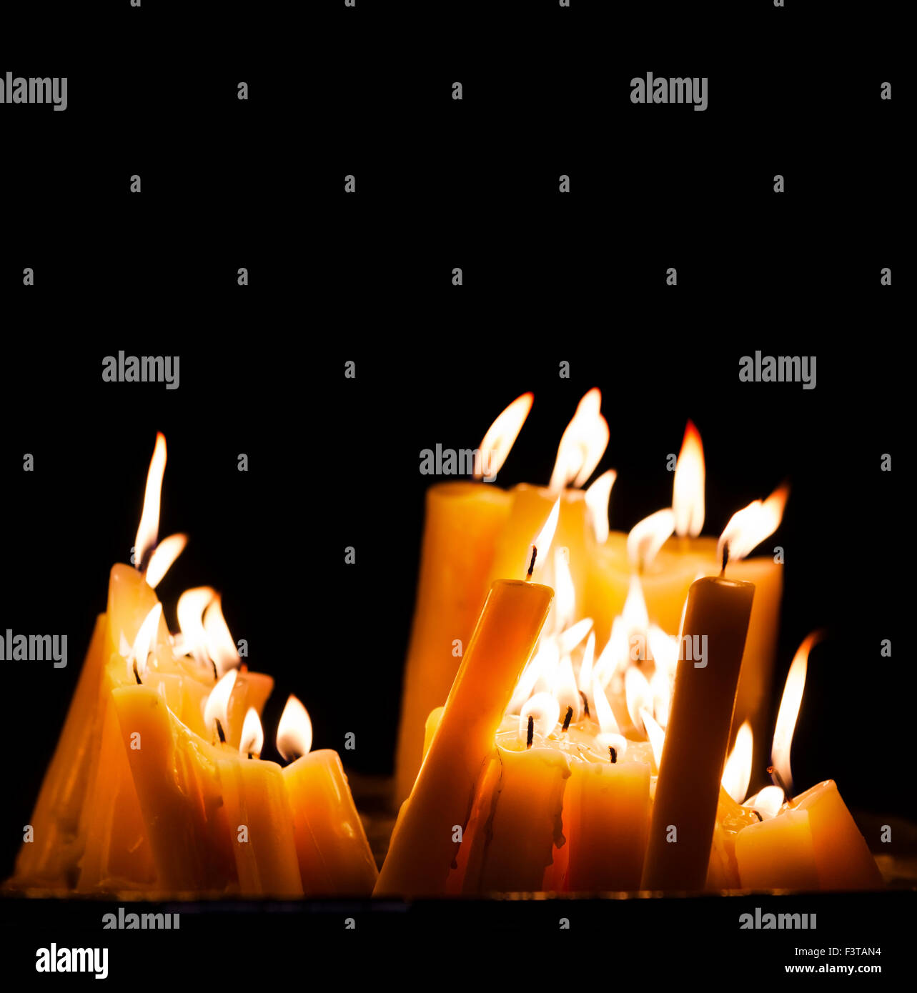 Lighted church candles in dark Stock Photo Alamy