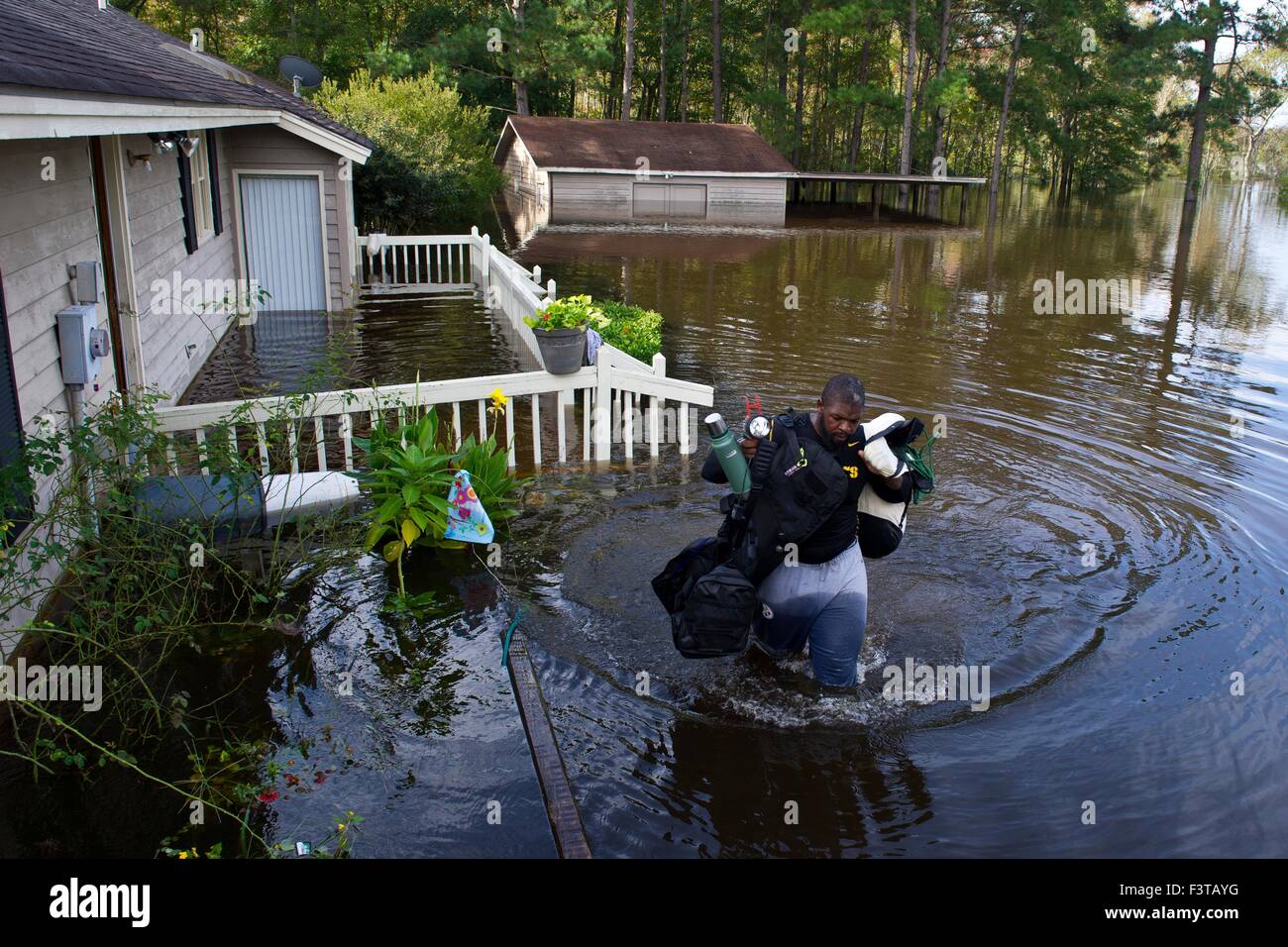 Pittsburgh Steelers football player Clifton Geathers helps remove